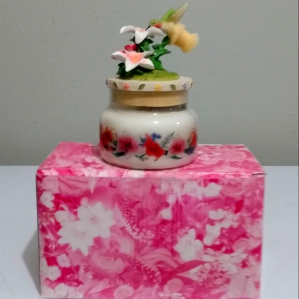 Avon collectable candle jar with hummingbird topper, still have the original box